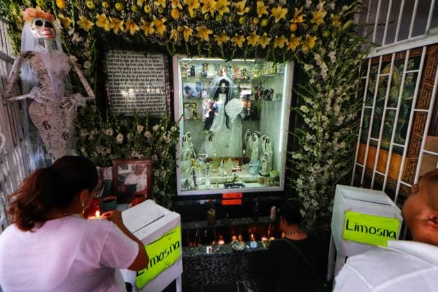 October 31, 2023 in Mexico City, Mexico: Hundreds of devotees of the Santa Muerte also known as White Girl visit the altar located at Morelos colony, to celebrate the 22nd anniversary of its founding, in the brave neighborhood of Tepito. On October 31, 2023. In Mexico City. Mexico City Mexico - ZUMAe321 20231031_zia_e321_033 Copyright: xCarlosxSantiagox