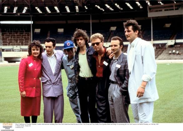 Press Conference at Wembley Stadium, London with musicians including Elton John, Bob Geldof from band Boomtown Rats, Gary Kemp and Tony Hadley from Spandau Ballet and Midge Ure promoting the Live Aid Concert to be held at Wembley on 13th July 1985. Ha Press Conference at Wembley Stadium, London with musicians including Elton John, Bob Geldof from band Boomtown Rats, Gary Kemp and Tony Hadley from Spandau Ballet and Midge Ure promoting the Live Aid Concert to be held at Wembley on 13th July 1985. Hanne Jordan Retna UK Credit all Uses, Credit: Hanne Jordan Retna UK Avalon  Copyright: x xHannexJordanx xRetnaxUKx xAvalonx 0524882518
