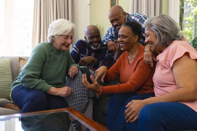 Happy diverse group of senior friends having video call and smiling in sunny living room Happy diverse group of senior friends having video call and smiling in sunny living room. Retirement, friendship, domestic life and senior lifestyle, communication, technology, unaltered., model released, , property released, Cape Town, South Africa, 27.09.2023, 4228941.jpg, people,happy,diverse group,senior,friend,video call,smiling,sunny,living room,retirement,friendship,domestic life,lifestyle,communication technology,unaltered,young,cheerful,happiness,fun,person,together,adult,leisure,portrait,smile,attractive,friends,cute,beautiful,joy,casual,summer,pretty,family,diverse,group,video,call,living,room,domestic,life,communication,technology Senior,El