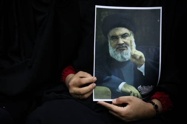 November 2, 2023, Tehran, Iran: An Iranian woman holds a portrait of the Secretary-General of Hezbollah, Hassan Nasrallah, during a pro-hijab and pro-government gathering in downtown Tehran. Thousands of Israelis and Palestinians have died since the militant group Hamas launched an unprecedented attack on Israel from the Gaza Strip on 07 October, and the Israeli strikes on the Palestinian enclave that followed it. Tehran Iran - ZUMAf146 20231102_zip_f146_076 Copyright: xRouzbehxFouladix