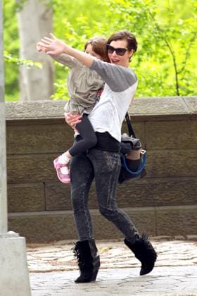 Milla Jovovich, wearing a Beastie Boys t-shirt, looks to be having a great time with daughter Ever while out on 5th Avenue in NYC 77390, NEW YORK, NEW YORK - Monday May 7, 2012. Milla Jovovich and daughter Ever Gabo Anderson look to be having a great time together as they are spotted walking on 5th Avenue near the Carlyle Hotel in New York City. Jovovich is seen paying her respects to the late Adam MCA Yauch by wearing a vintage Beastie Boys t-shirt. , Credit:PacificCoastNews.com Avalon USA, New York  Copyright: xPacificCoastNews.comx xAvalonx 0527606503