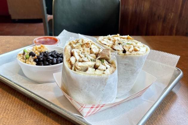 November 1, 2023: Chicken burrito with onion and cilantro from Carbon Live Fire Mexican Grill. - ZUMAm67_ 20231101_zaf_m67_044 Copyright: xNickxKindelspergerx