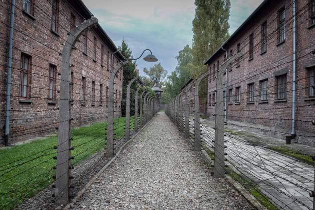 Auschwitz concentration camp Barbed wire fence and watchtowers to prevent prisoners from escaping from the concentration camp xMMx