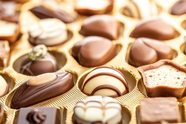 Sweet chocolate pralines. Tasty chocolate truffles in box. Sweet chocolate pralines. Tasty chocolate truffles in the box. Copyright: xZoonar.com JirixHERAx 20333280