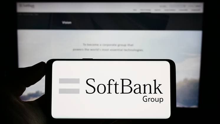 Person holding cellphone with logo of Japanese investment company SoftBank Group Corp. on screen. Stuttgart, Germany - 06-16-2023: Person holding cellphone with logo of Japanese investment company SoftBank Group Corp. on screen in front of webpage. Focus on phone display. Copyright: xZoonar.com TimonxSchneiderx 20437123