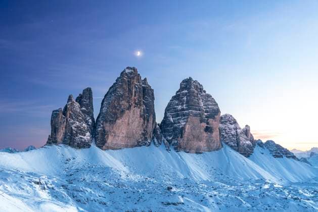 Moon above Tre Cime di Lavaredo at dusk, winter time, Tre Cime di Lavaredo (Lavaredo peaks) (Drei Zinnen), Sesto (Sexten), Dolomites, South Tyrol, Italy, Europe Copyright: PaoloxGraziosi 1361-295 RECORD DATE NOT STATED