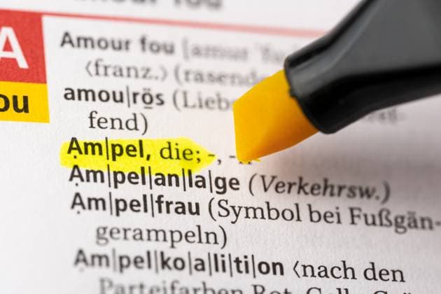 Bavaria, Germany - April 2, 2023: The word Ampel in a Duden dictionary marked with a pen *** Das Wort Ampel in einem Wörterbuch Duden markiert mit einem Stift