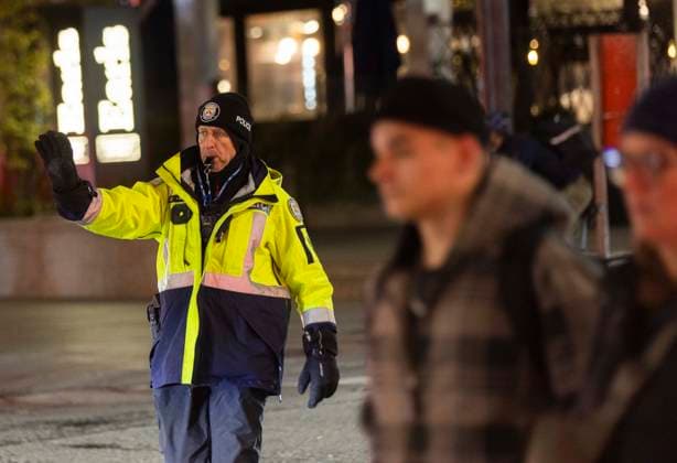 (231123) -- TORONTO, Nov. 23, 2023 -- A policeman on duty is seen in the street in Toronto, Canada, on Nov. 22, 2023. Toronto Police announced increasing patrols of uniformed officers throughout the city due to a vehicle explosion Wednesday at a border crossing between the United States and Canada in Niagara Falls. (Photo by Xinhua) CANADA-TORONTO-POLICE PATROL-INCREASE ZouxZheng 