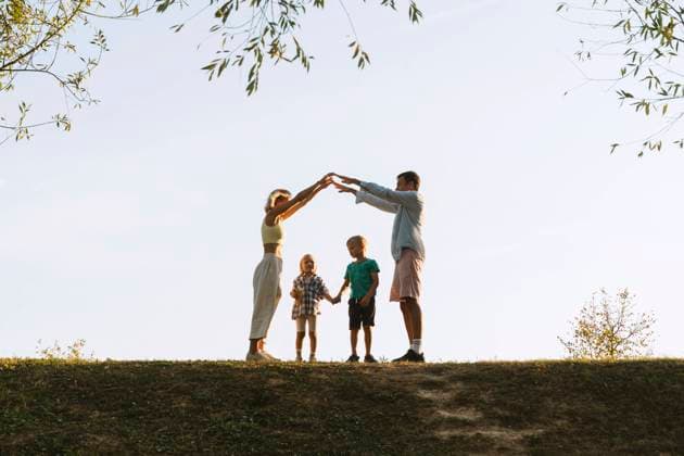 Happy parents playing with children in park model released, Symbolfoto, NDEF01276