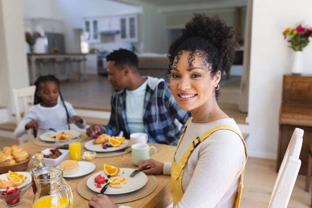 Happy african american woman sitting at table, having a snack with family at home, copy space Happy african american woman sitting at table, having a snack with family at home, copy space. Togetherness, parenthood, childhood, food and drink, domestic life and healthy lifestyle, unaltered., model released, , property released, Cape Town, South Africa, 17.10.2023, 4913146.jpg, people,happy,african american,woman,sitting,table,snack,family home,copy space,togetherness,parenthood,childhood,food drink,domestic life,healthy lifestyle,kid,little,young,happiness,cheerful,fun,family,smiling,cute,lifestyle,smile,together,parent,person,portrait,mother,delicious,joy,tasty,african,american,home,copy,space,food,drink,domestic,life,healthy Young Adult,Wo
