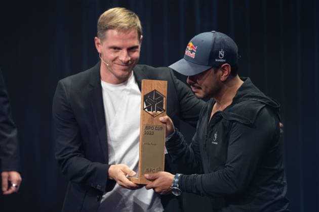 Sebastian STEUDTNER, big wave surfer, presents the ISPO Award to mountaineer Nirmal PURJA, German Sustainability Award ceremony in Duesseldorf on 24 11 2023