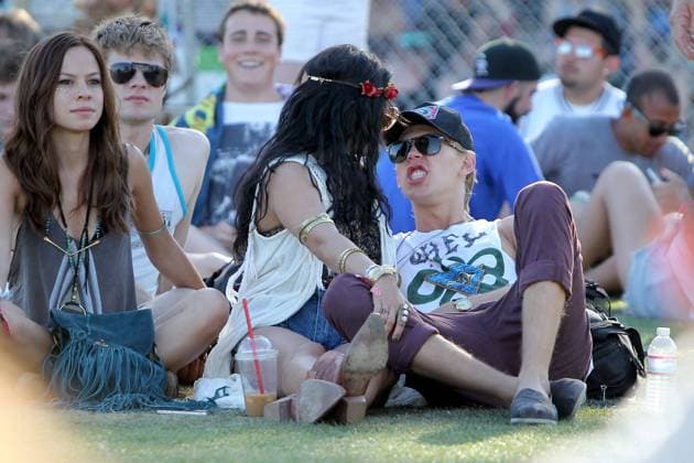 Vanessa Hudgens and boyfriend Austin Butler engage in some PDA as they continue to enjoy their weekend at the Coachella festival 2012 76321, INDIO, CALIFORNIA - Sunday April 15, 2012. Vanessa Hudgens and boyfriend Austin Butler continue to enjoy their weekend at the Coachella festival 2012. Vanessa looked very hippie chic with a rose petal headband as she engaged in some PDA in the grass with her beau. , Credit:Ben Dome Nathanael Jones Avalon USA, Indio  Copyright: xBenxDome NathanaelxJonesx xAvalonx 0527569160