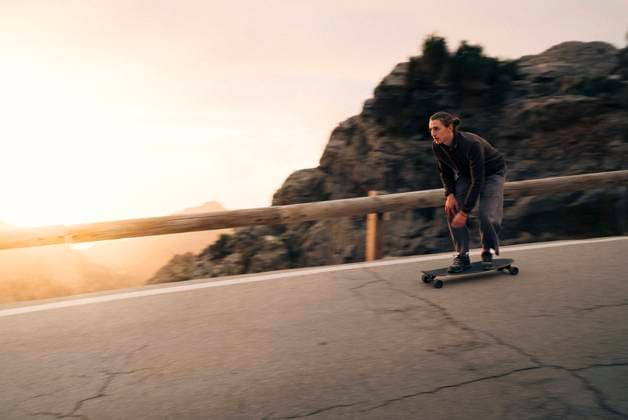Man skateboarding near railing on road at sunset Spain, Mallorca, model released Copyright: xMaskotx , MA104895 MA104895