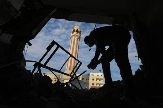 Palestinians inspect the wreckage following an Israeli air strike on the Jaffa Mosque and Hospital in Dair El-Balah Palestinians inspect the wreckage following an Israeli air strike on the Jaffa Mosque and Hospital in Dair El-Balah, on December 8, 2023. amid continuing battles between Israel and the Palestinian militant group Hamas. Fighting raged on December 8 across Gaza between Israel and Hamas as the UN Security Council was due to meet to demand a ceasefire in a war now in its third month. Photo by Omar Ashtawy apaimages Dair El-Balah Gaza Strip Palestinian Territory 081223_Dair_El-Balah_OSH_00(65) Copyright: xapaimagesxOmarxAshtawyx xapaimagesx