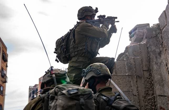 (231210) -- GAZA, Dec. 10, 2023 () -- This photo released by the Israel Defense Forces (IDF) on Dec. 10, 2023 shows Israeli troops conducting military operations in the Gaza Strip. () MIDEAST-GAZA STRIP-IDF GROUND OPERATIONS Xinhua 