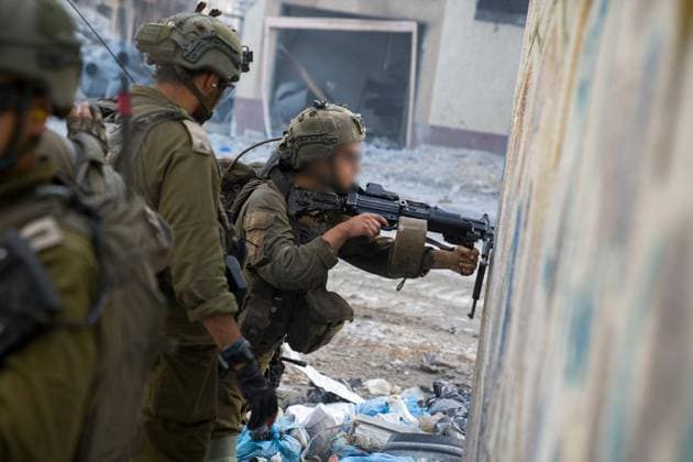 (231210) -- GAZA, Dec. 10, 2023 () -- This photo released by the Israel Defense Forces (IDF) on Dec. 10, 2023 shows Israeli troops conducting military operations in the Gaza Strip. () MIDEAST-GAZA STRIP-IDF GROUND OPERATIONS Xinhua 
