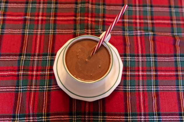 cup of hot chocolate on a Christmas colored tablecloth Somerville, New Jersey, United States R_PUNF231210-1301302-01