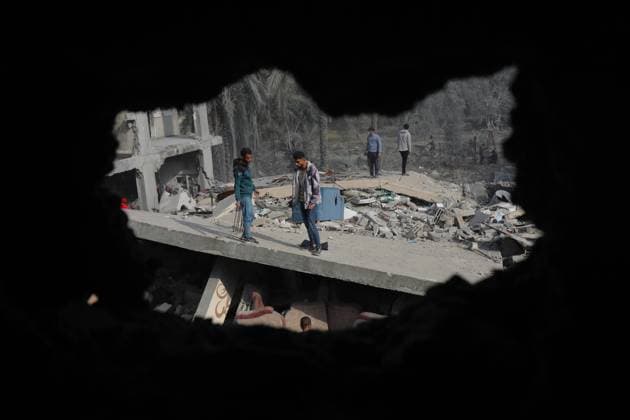 A view of the damaged area after Israeli air strikes on December 12, 2023 in Dair El-Balah, Gaza A view of the damaged area after Israeli air strikes on December 12, 2023 in Dair El-Balah, Gaza. Israeli warplanes launched an airstrike on Dair El-Balah city in the Central Gaza Strip, destroying or severely damaging several buildings. Some Palestinians collected usable belongings from the rubble of their ruined houses. Photo by Omar Ashtawy apaimages Dair El-Balah Gaza Strip Palestinian Territory 121223_Dair_El-Balah_OSH_00(25) Copyright: xapaimagesxOmarxAshtawyx xapaimagesx