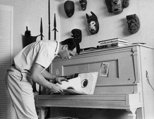 Rock Hudson at Home Actor Rock Hudson with records at his house Los Angeles, CA USA  Copyright: xLeoxFuchsx R0046-Hudson