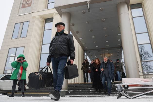 RUSSIA, MOSCOW - DECEMBER 14, 2023: Oleg Orlov (front), co-founder of the Memorial Russian human rights organization (declared a foreign agent in Russia and shut down upon court order), leaves the Moscow City Court after a hearing into an appeal by his lawyers against his sentence in the case of repeated discrediting of the Russian military. Orlov was sentenced to a fine of 150,000 rubles ($1,664) in October 2023. The Moscow City Court revoked the sentence and remanded the case for retrial. Alexander Shcherbak TASS  65748629