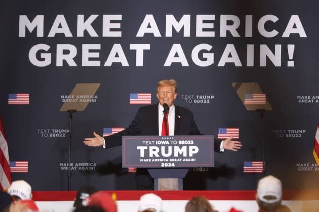 Former U.S. President and Republican presidential candidate Donald Trump gestures at a campaign event in Coralville, Iowa on Wednesday, December 13, 2023. The Iowa Caucus is planned to take place on January 15, 2024.  CORP2023121308 AlexxWroblewski