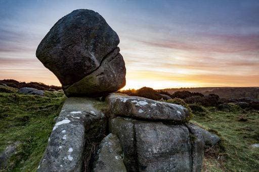 The rocks at Owler Tor under a cloudy sky during the sunset in the Peak District in the UK 240885 RECORD DATE NOT STATED