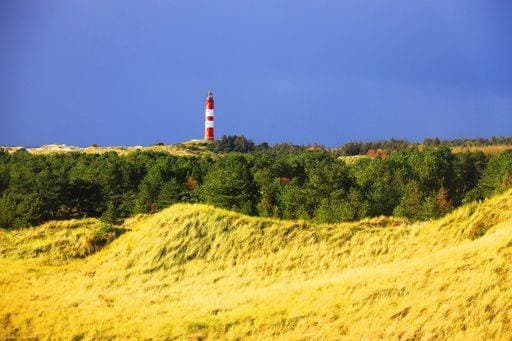 A long shot of a lighthouse at Amrum, Germany during daytime 274861 RECORD DATE NOT STATED