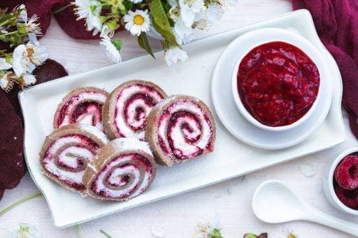 An amazing view of tasty looking raspberry rolls and raspberry jam put on a white plate 332319 RECORD DATE NOT STATED