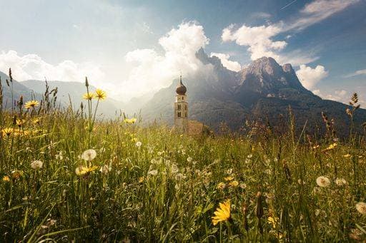A beautiful shot of the St. Valentin Chapel surrounded with majestic mountains in Italy 383954 RECORD DATE NOT STATED