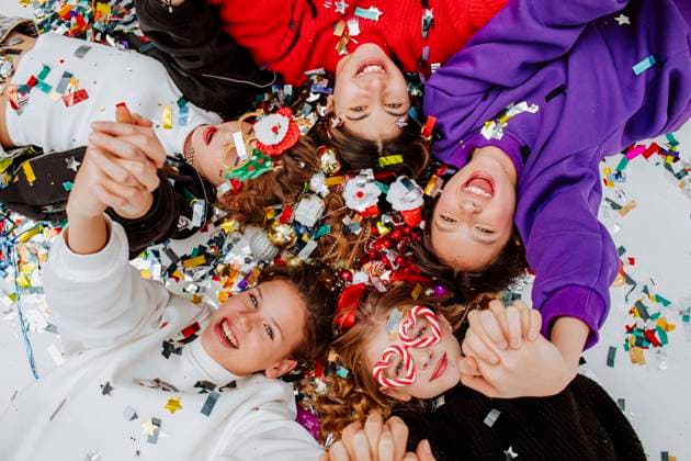 Happy friends lying with Christmas decorations model released, Symbolfoto property released, MDOF01747