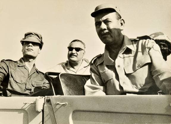Egyptian President Gamal Abdel Nasser Egyptian President Gamal Abdel Nasser (center) and Libyan Colonel Muammar Gaddafi (left) on a jeep tour at an unknown location with the Egyptian Armed Forces 6.13.1970. Nasser nationalized the Suez Canal in 26 July 1956 in a publicized speech, which enraged the major countries and resulted in a war against Egypt of tripartite aggression by France, England and Israel. Photograph Collection of Barry Iverson Egypt EDITORIAL USE ONLY Copyright: xx BarryxIversonxPhotographyx bivphotos005873