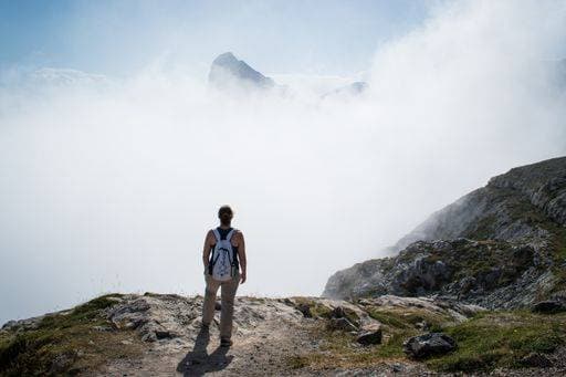 unrecognizable woman looking at a mountain in Picos de Europa, Spain 1111807 RECORD DATE NOT STATED