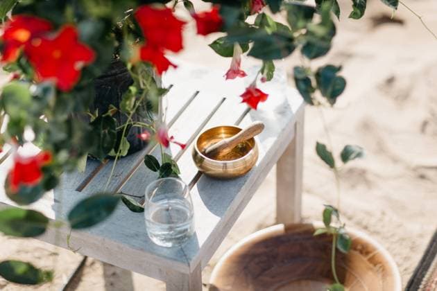 Tibetan singing bowl and wood bowl for meditative wedding ceremony Madison, Connecticut, United States R_CATO220210-923774-01