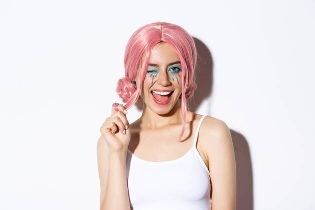 Portrait of sassy attractive girl in pink wig, wearing outfit for halloween party, smiling and winking at camera, standing over white background Portrait of sassy attractive girl in pink wig, wearing outfit for halloween party, smiling and winking at camera, standing over white background. ,model released, Symbolfoto Copyright: xZoonar.com SevaxLevitskyx 16103992 ,model released, Symbolfoto ,property released