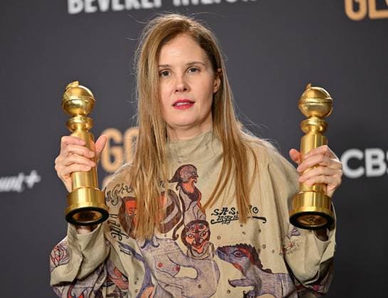 Justine Triet appears backstage after winning the award for Best Screenplay, Motion Picture award for Anatomy of a Fall during the 81st annual Golden Globe Awards at the Beverly Hilton in Beverly Hills, California on Sunday, January 7, 2024.  LAP202401070144 CHRISxCHEW