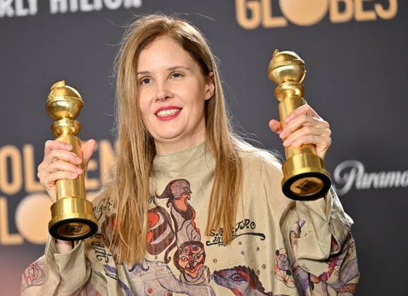 Justine Triet appears backstage after winning the award for Best Screenplay, Motion Picture award for Anatomy of a Fall during the 81st annual Golden Globe Awards at the Beverly Hilton in Beverly Hills, California on Sunday, January 7, 2024.  LAP202401070145 CHRISxCHEW