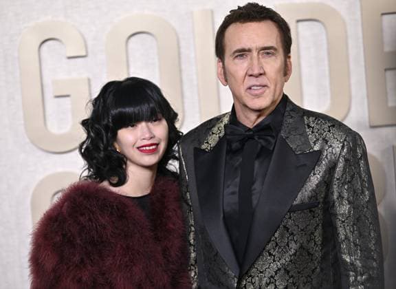 (L-R) Riko Shibata and Nicolas Cage arrive for the 81st annual Golden Globe Awards at the Beverly Hilton in Beverly Hills, California on Sunday, January 7, 2024.  LAP202401070243 CHRISxCHEW