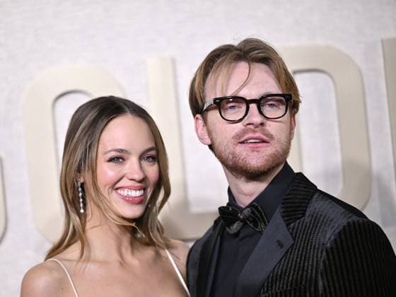 (L-R) Claudia Sulewski and FINNEAS arrive for the 81st annual Golden Globe Awards at the Beverly Hilton in Beverly Hills, California on Sunday, January 7, 2024.  LAP202401070287 CHRISxCHEW