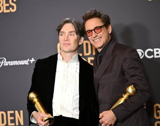 (L-R) Cillian Murphy, winner of the Best Performance by a Male Actor in a Motion Picture ? Drama for Oppenheimer, and Robert Downey Jr., winner of the Best Performance by a Male Actor in a Supporting Role in a Motion Picture award for Oppenheimer, during the 81st annual Golden Globe Awards at the Beverly Hilton in Beverly Hills, California on Sunday, January 7, 2024.  LAP202401070320 CHRISxCHEW