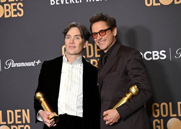 (L-R) Cillian Murphy, winner of the Best Performance by a Male Actor in a Motion Picture ? Drama for Oppenheimer, and Robert Downey Jr., winner of the Best Performance by a Male Actor in a Supporting Role in a Motion Picture award for Oppenheimer, during the 81st annual Golden Globe Awards at the Beverly Hilton in Beverly Hills, California on Sunday, January 7, 2024.  LAP202401070321 CHRISxCHEW