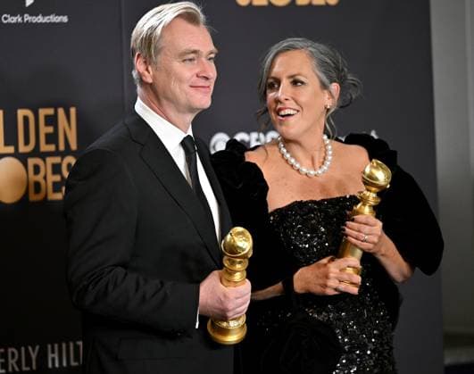 (L-R) Christopher Nolan and Emma Thomas, winners of the Best Motion Picture - Drama for Oppenheimer, during the 81st annual Golden Globe Awards at the Beverly Hilton in Beverly Hills, California on Sunday, January 7, 2024.  LAP202401070352 CHRISxCHEW