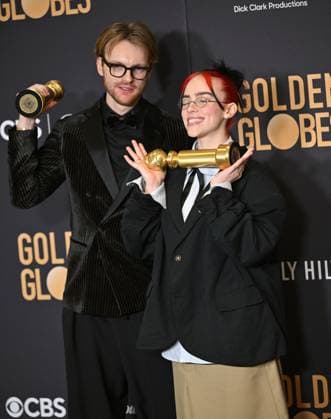 (L-R) FINNEAS and Billie Eilish appear backstage after winning the award for the Best Original Song, Motion Picture award for Barbie ? What Was I Made For? during the 81st annual Golden Globe Awards at the Beverly Hilton in Beverly Hills, California on Sunday, January 7, 2024.  LAP202401070302 CHRISxCHEW