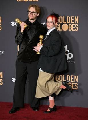 (L-R) FINNEAS and Billie Eilish appear backstage after winning the award for the Best Original Song, Motion Picture award for Barbie ? What Was I Made For? during the 81st annual Golden Globe Awards at the Beverly Hilton in Beverly Hills, California on Sunday, January 7, 2024.  LAP202401070303 CHRISxCHEW