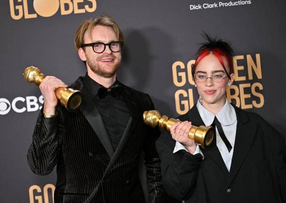 (L-R) FINNEAS and Billie Eilish appear backstage after winning the award for the Best Original Song, Motion Picture award for Barbie ? What Was I Made For? during the 81st annual Golden Globe Awards at the Beverly Hilton in Beverly Hills, California on Sunday, January 7, 2024.  LAP202401070305 CHRISxCHEW
