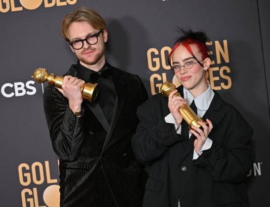 (L-R) FINNEAS and Billie Eilish appear backstage after winning the award for the Best Original Song, Motion Picture award for Barbie ? What Was I Made For? during the 81st annual Golden Globe Awards at the Beverly Hilton in Beverly Hills, California on Sunday, January 7, 2024.  LAP202401070306 CHRISxCHEW
