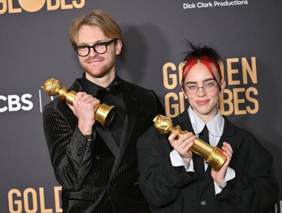 (L-R) FINNEAS and Billie Eilish appear backstage after winning the award for the Best Original Song, Motion Picture award for Barbie ? What Was I Made For? during the 81st annual Golden Globe Awards at the Beverly Hilton in Beverly Hills, California on Sunday, January 7, 2024.  LAP202401070308 CHRISxCHEW