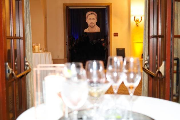 January 13, 2024, Santa Barbara, California, U.S.A: A photo of Ryan Gosling in the banquet hall behind a table with glamorous drinks and a photographer walking by. Gosling is about to receive the Kirk Douglas Award for Excellence in Film from Santa Barbara International Film Festival 2024 on January 13. The exclusive dinner gala and fundraiser was held at the Ritz-Carlton Hotel, Santa Barbara. Santa Barbara U.S.A - ZUMAk144 20240113_znp_k144_052 Copyright: xAmyxKatzx