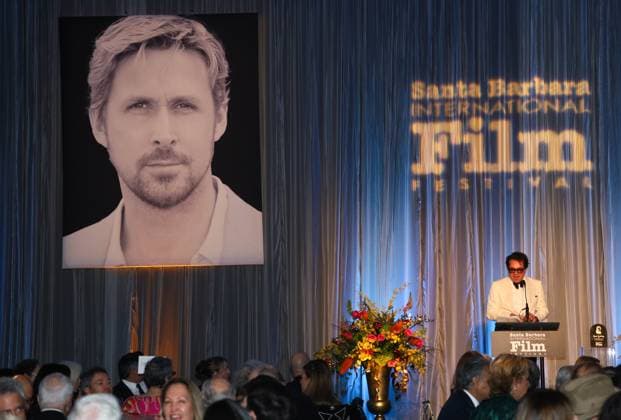 January 13, 2024, Santa Barbara, California, U.S.A: Executive Director of SBIFF Roger Durling welcomes guests and talks about the man of honor Ryan Gosling as his photo stares out from the curtain behind him, during the Kirk Douglas Award for Excellence in Film fundraising gala for the Santa Barbara International Film Festival 2024, on January 13. The exclusive dinner event (where Gosling and Barbie Director Greta Gerwig spoke later) was held at the Ritz-Carlton Hotel, Santa Barbara. Santa Barbara U.S.A - ZUMAk144 20240113_znp_k144_069 Copyright: xAmyxKatzx