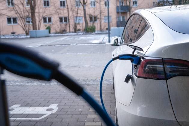 Augsburg, Bavaria, Germany - January 14, 2024: A Tesla Model Y electric car charging at a charging station for electric cars