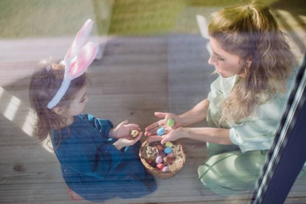 Little girl holding basket and showing her mother easter eggs which she found. Little girl holding basket and showing mother easter eggs which she found. model released Copyright: xx HHH FAMILY EASTER PH 2023 HHH 413